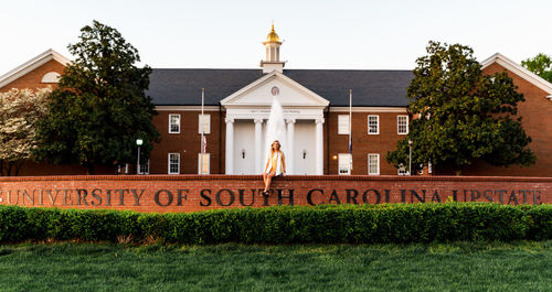 Exterior of building by trees against sky