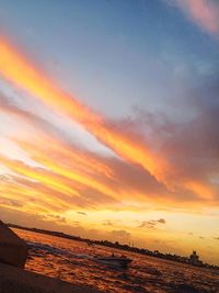 Scenic view of sea against sky at sunset