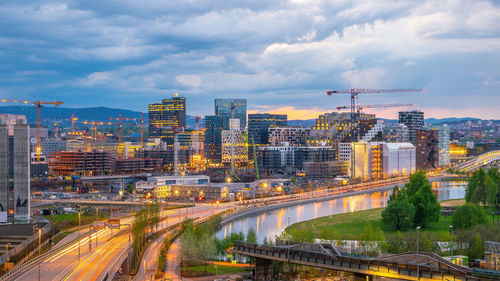 High angle view of illuminated buildings in city against sky