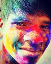 Close-up portrait of young man with powder paint