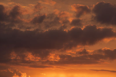Low angle view of dramatic sky during sunset
