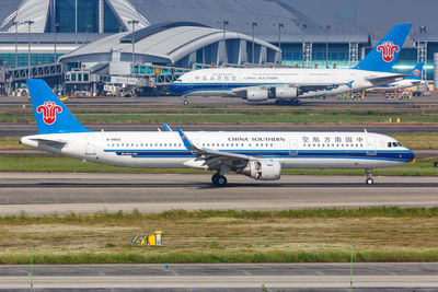 View of airplane at airport runway