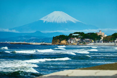 Scenic view of sea against blue sky