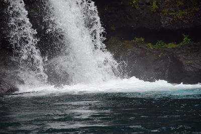 Sea waves splashing on rocks