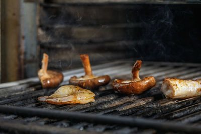 Close-up of meat on barbecue grill