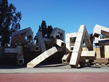 Low angle view of monument on sunny day