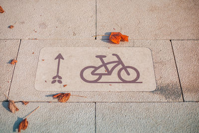 High angle view of text on footpath