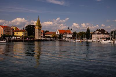 River amidst buildings against sky in city
