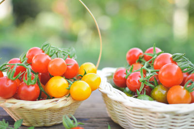 Close-up of cherry tomatoes in baskets on table