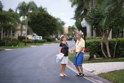 Senior couple walking hand in hand enjoying retirement