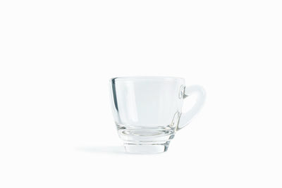 Close-up of glass of water against white background