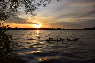 Scenic view of lake against sky during sunset