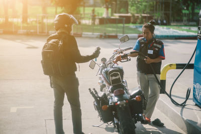 Full length of boys on motorcycle