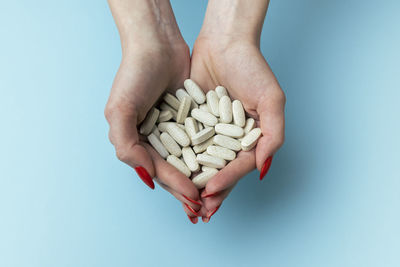 Many pills in the female hands of a doctor. medical background. drug overdose. poisoning. 