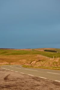 Scenic view of rural landscape against clear sky