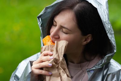 Portrait of woman eating food