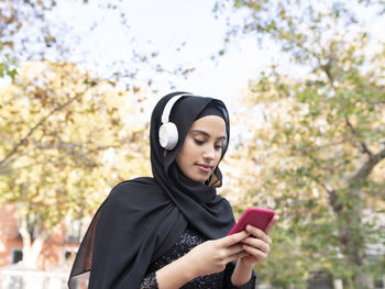 Young woman using mobile phone