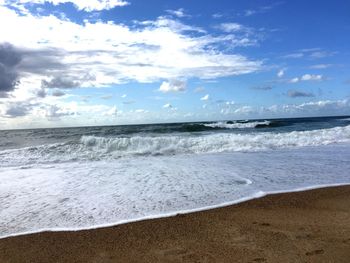 Scenic view of beach against sky