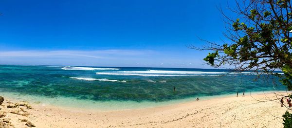 Scenic view of sea against blue sky