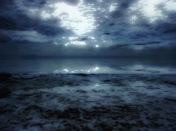 Scenic view of sea against cloudy sky