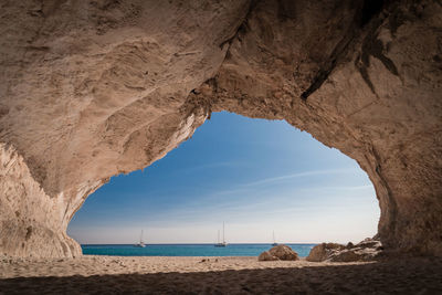 Scenic view of sea seen through cave