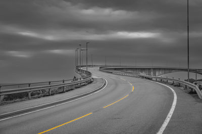 View of highway against cloudy sky