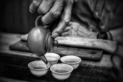 Preparing traditional chinese tea at lau yu fat tea shop in hong kong