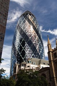 Low angle view of building against cloudy sky