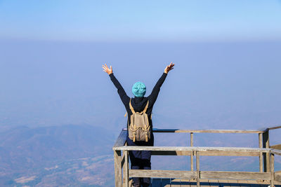 Rear view of woman standing at observation point