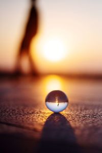 Close-up of reflection of sun in water