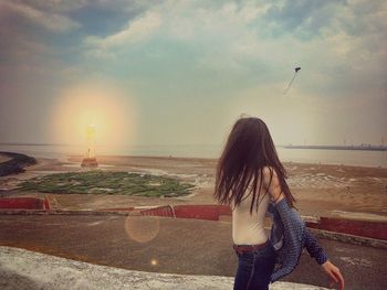 Woman standing on beach