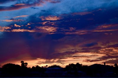 Scenic view of dramatic sky at sunset