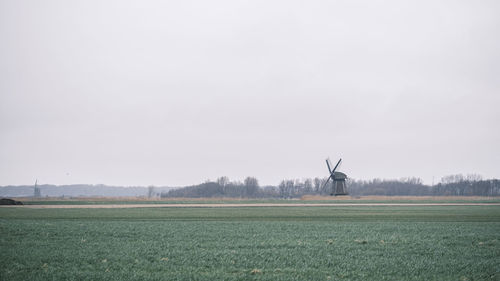 Scenic view of field against clear sky