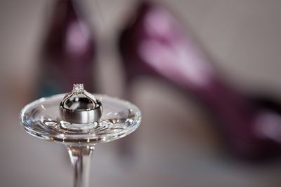 Close-up of wedding rings on table