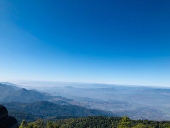 Scenic view of mountains against clear blue sky