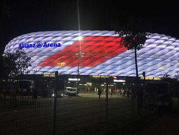 Illuminated subway station against sky