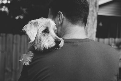 Close-up of man with dog