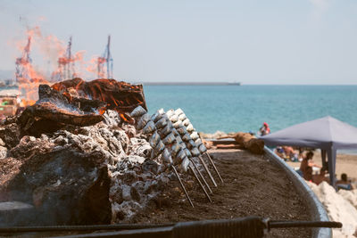 Sardines grilled on the beach. traditional espeto  fish meal in malaga city, spain