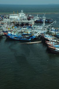 High angle view of harbor by sea against sky