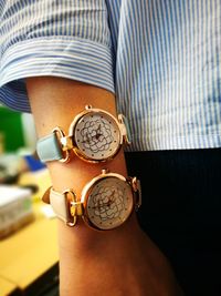 Close-up of woman wearing wristwatches