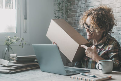 Young woman using laptop at office