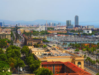 High angle view of buildings and trees against sky