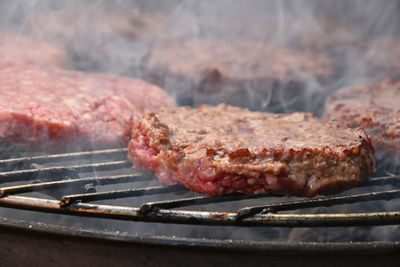 Close-up of meat on barbecue grill