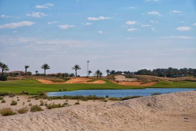 View of golf course against sky