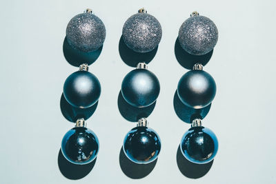 Close-up of christmas decorations against white background