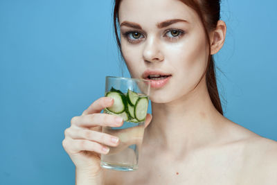 Portrait of woman drinking drink