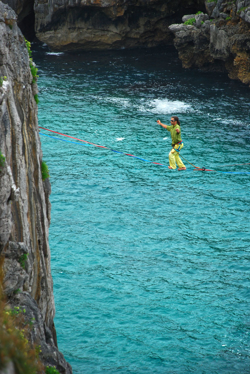 MAN SURFING IN SEA