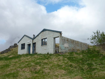 House on field against sky