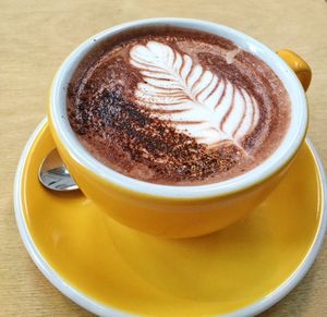 Close-up of cappuccino on table