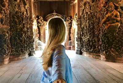 Rear view of woman at temple